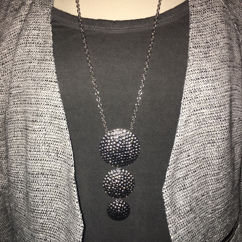 Long silver statement necklace.